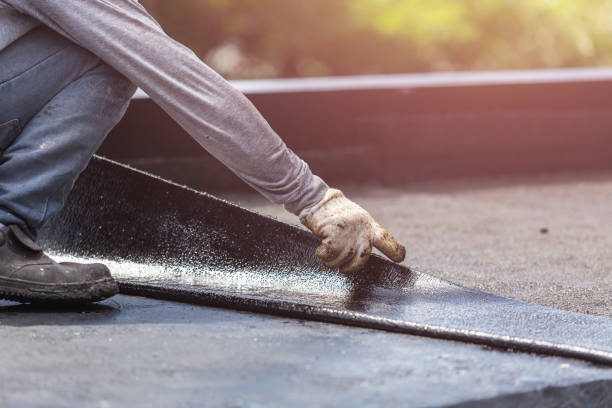Professional Basement Waterproofing technician working in East Liberty, OH